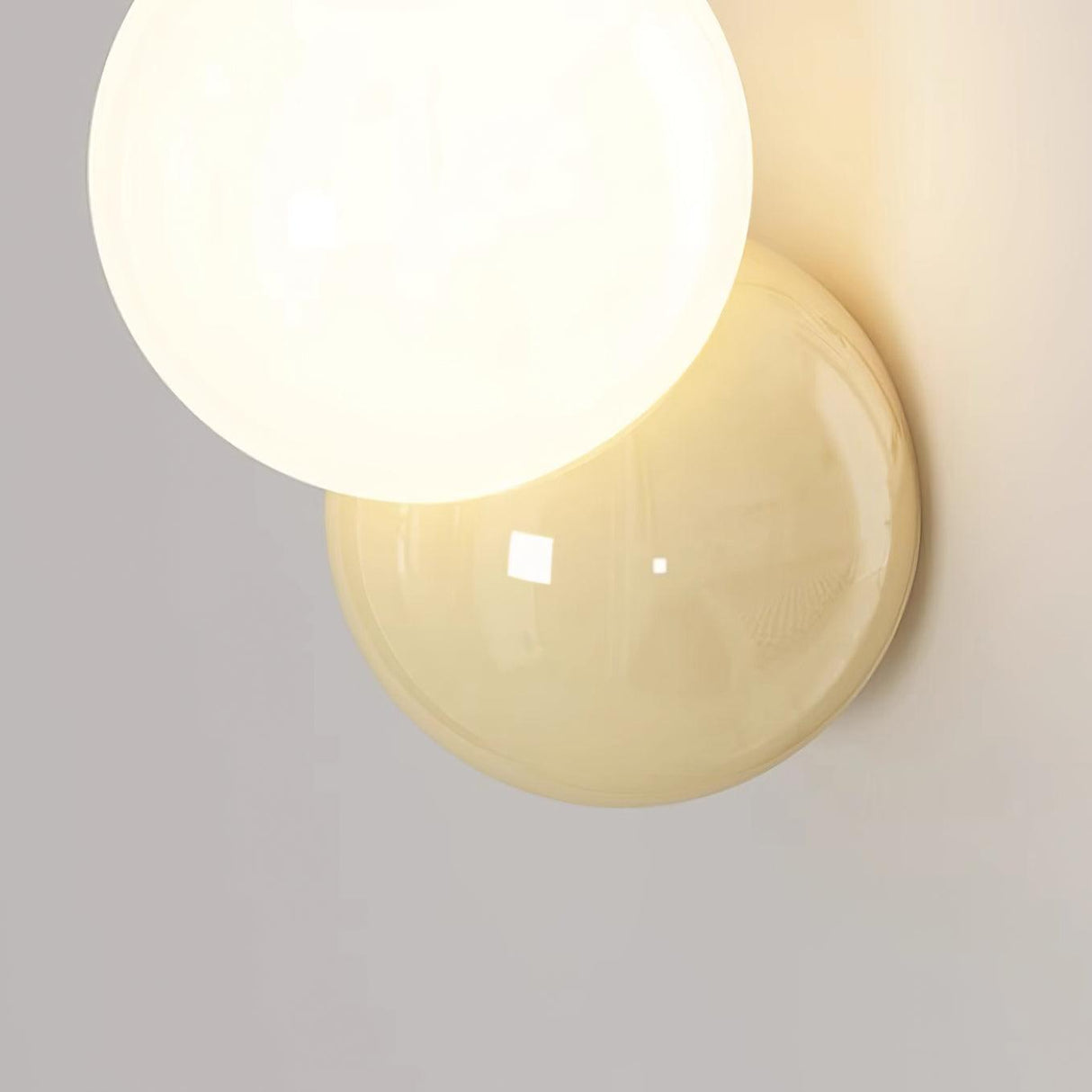 Large close view of the lit globe and the butter yellow disc behind it
