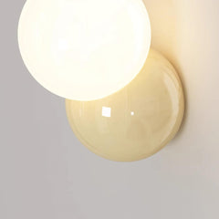 Large close view of the lit globe and the butter yellow disc behind it