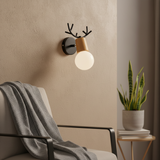 Black antler sconce with a wooden shade and exposed bulb