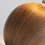 Close up of the turned walnut ball base showing the wood grain