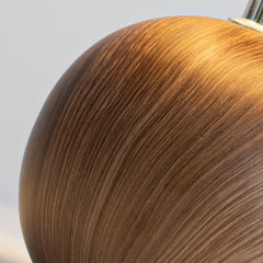 Close up of the turned walnut ball base showing the wood grain