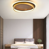 Top view of the walnut panel and gold ring on the flush mount light