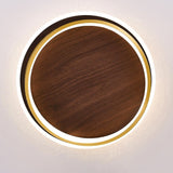 Close detail of the gold ring framing the walnut grain panel