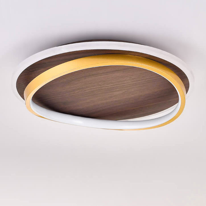 Underside view of the round walnut and gold ceiling light