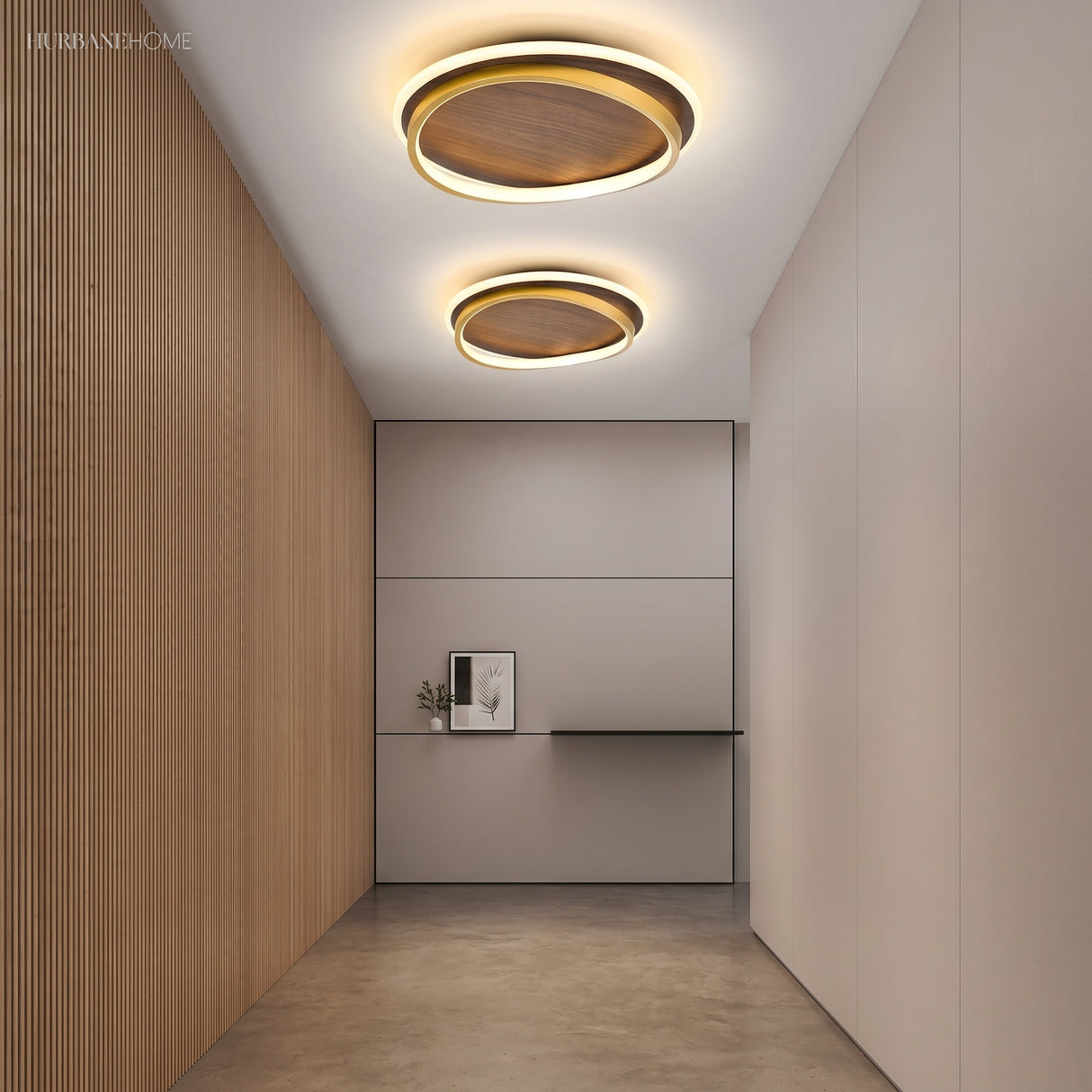 Two round walnut ceiling lights glowing along a minimalist hallway