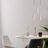 Water drop pendant light shown lit against a neutral interior backdrop