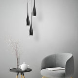 Water drop pendant light hanging over a styled interior setting