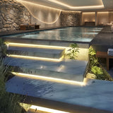 LED strip following a winding garden path beside planting and stone