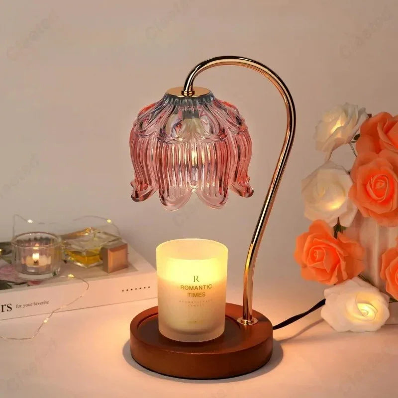 Candle warmer lamp with a curved brass arm and round wooden base