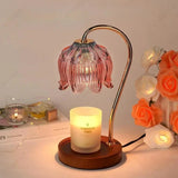 Candle warmer lamp with a curved brass arm and round wooden base