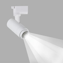 White adjustable track spotlight with extended zoom head and light beam