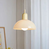 White shade bowl pendant light with a coloured metal cap swatch