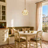 White petal glass pendant light shown against a neutral studio background