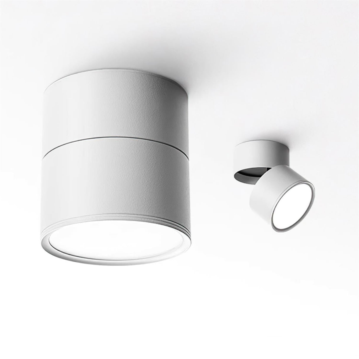 Two white spot lights shown at different tilt angles on a pale background