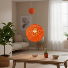 Orange woven globe pendant on a white cord
