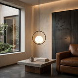 Black Oval Frame Glass Globe Pendant Light in a styled room