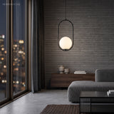 Black Oval Frame Glass Globe Pendant Light in a living space
