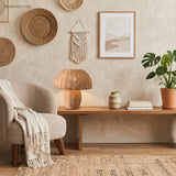 Woven rattan table lamp glowing softly on a bedroom nightstand