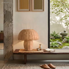 Boho rattan table lamp styled in a warm modern living space