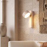 Travertine Rotatable Wall Lamp in a bedroom setting