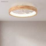 Low profile wood ceiling fan light with clear blades in a bedroom