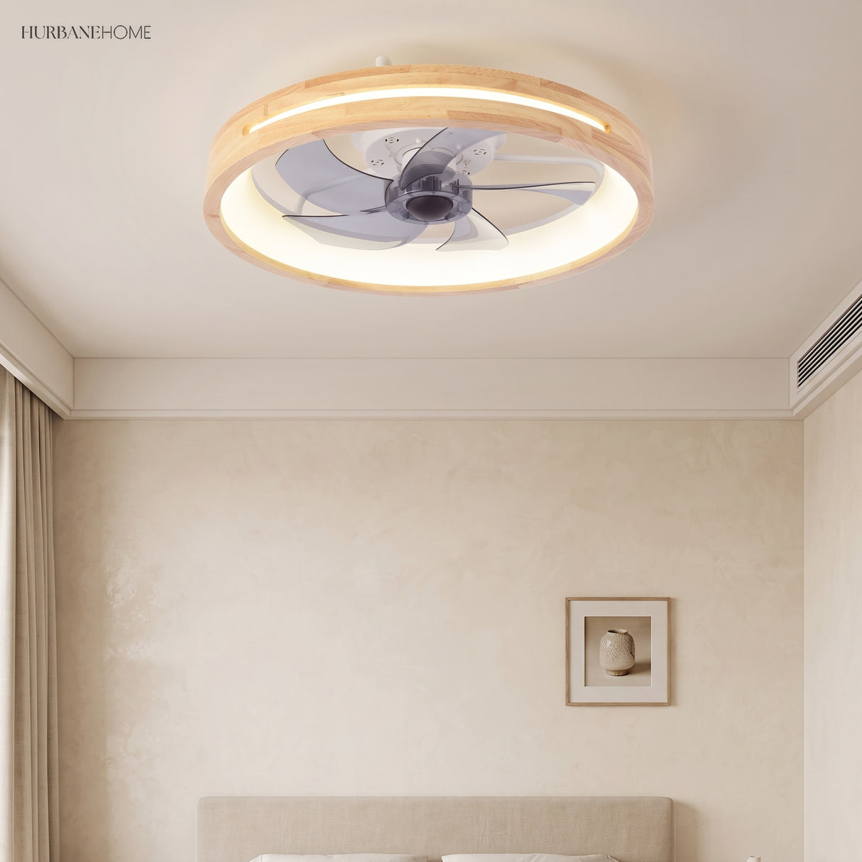 Round ceiling fan with light above a bed near a framed print