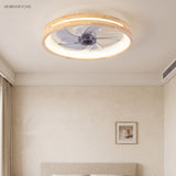 Round ceiling fan with light above a bed near a framed print