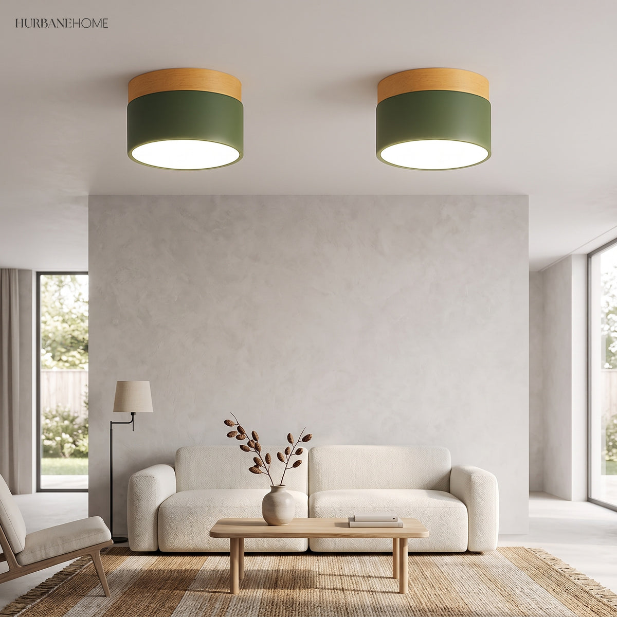 Two green ceiling lights lit above a sofa and coffee table