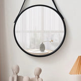 Wood framed round mirror with leather strap hanging detail