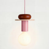 Multicolor geometric wood pendant light shown against a plain studio background