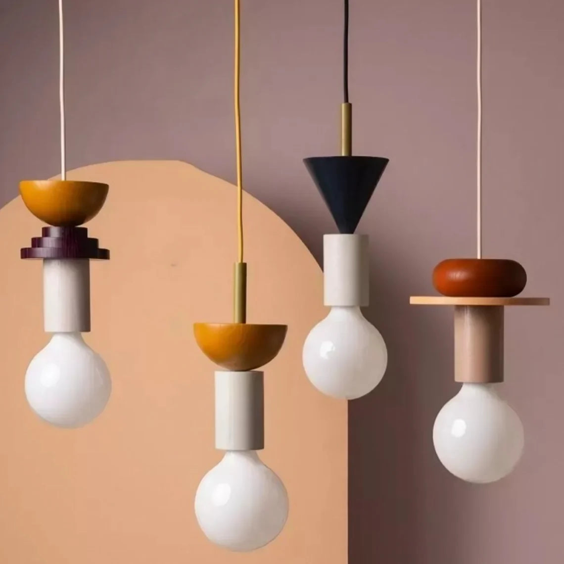 Sculptural geometric pendant light with exposed bulb in a modern room