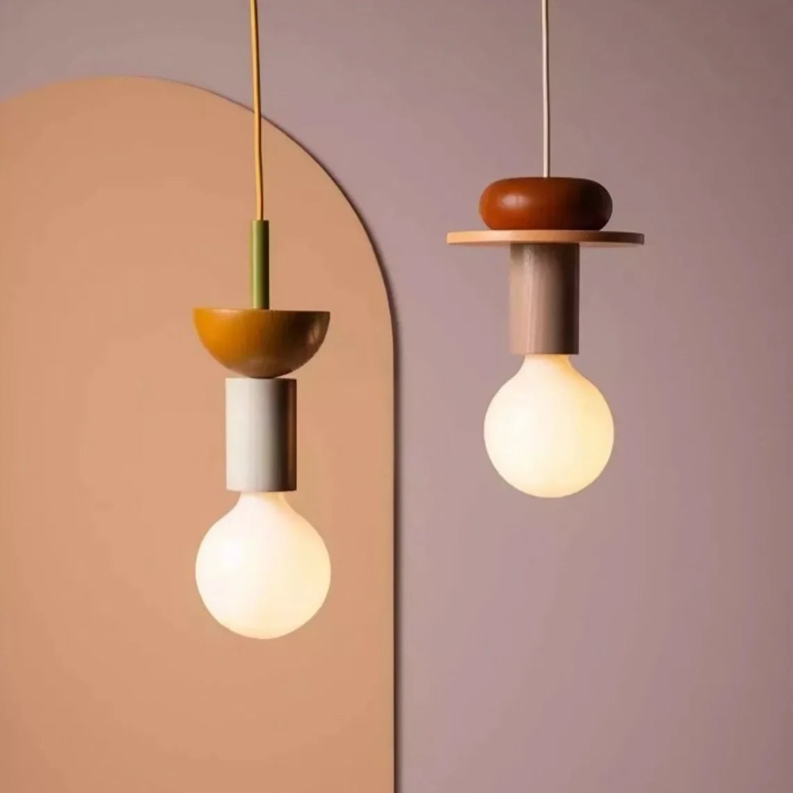 Wood pendant light with stacked painted shapes styled in a modern room scene