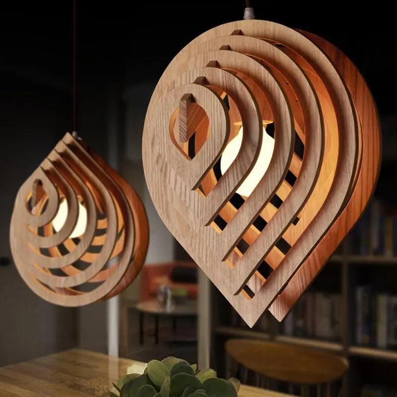 Two layered wood pendants glowing in a dark timber room