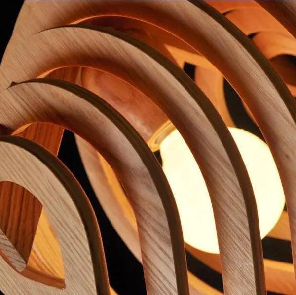 Close view of the curved wood slats glowing around the bulb