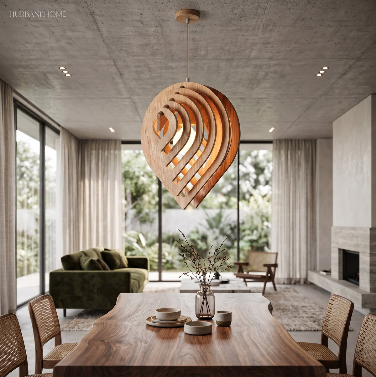 Wood teardrop pendant lit above a long dining table