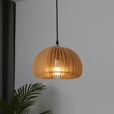 Wood slat dome pendant lit showing the bulb through the slats