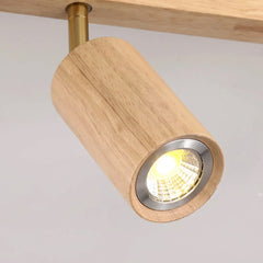 Close up of a single lit oak spotlight head with its metal reflector