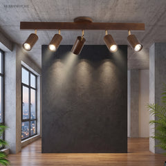 Walnut track lighting bar lighting a dark feature wall in a loft