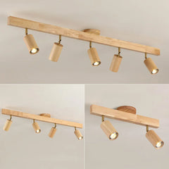 Studio view of the walnut five head bar with three and two head insets