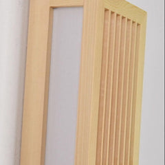 Detail of the light wood frame, slats and acrylic diffuser panel unlit