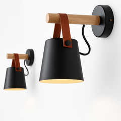 Two black sconces in different sizes shown side by side
