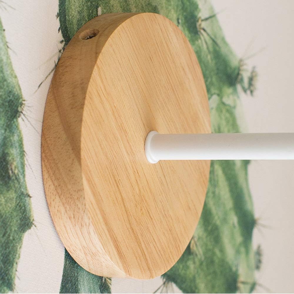 Close view of the round wood backplate and the white arm