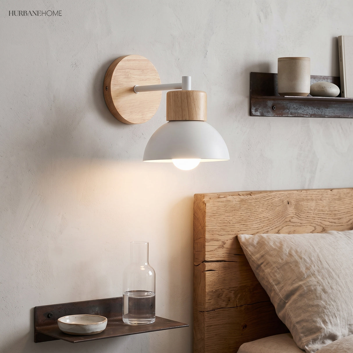 Wood wall sconce with a white dome lit beside a timber headboard