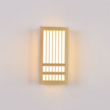 Small wood wall sconce lit straight on with a warm even glow