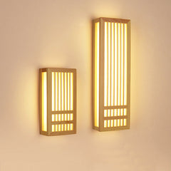 Small and large wood wall sconces shown side by side and lit