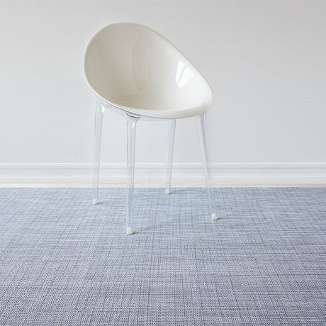 woven floor mat styled in modern entryway interior