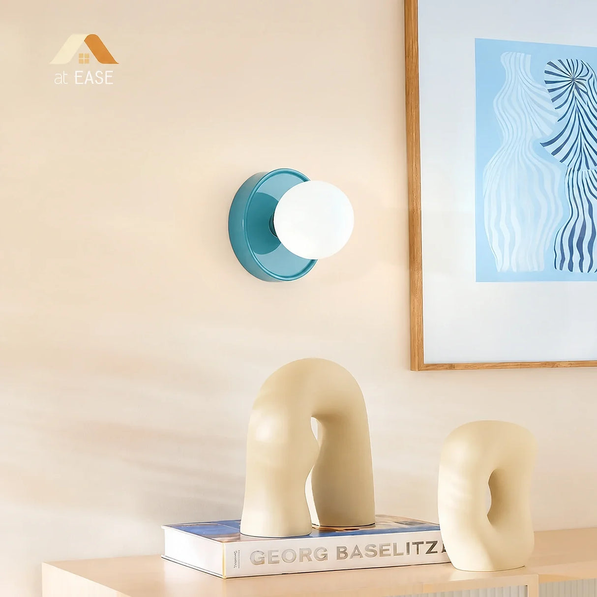 Yellow ceramic orb wall sconce with a frosted glass globe front on