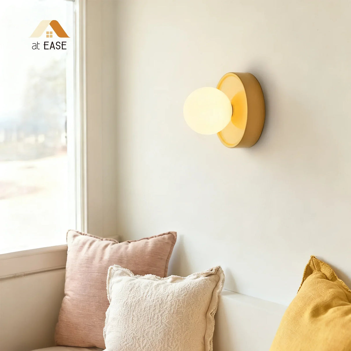 Yellow orb wall sconce detail highlighting the smooth ceramic backplate