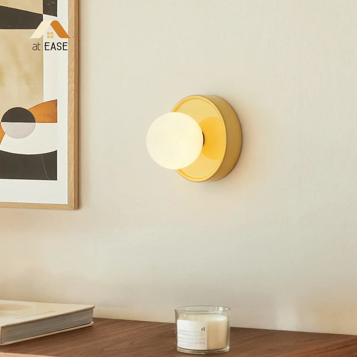 Yellow orb wall sconce shown at an angle with the glass globe in front