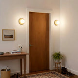 Yellow orb wall sconce rear detail of the round wall mounting plate